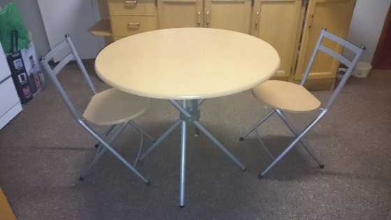 Table with 3 fold up chairs