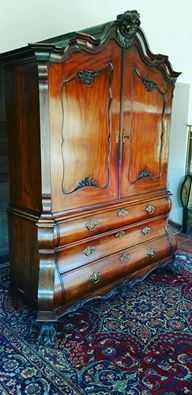 This massive but elegant 19th Century Rococo Mahogany Linen Press