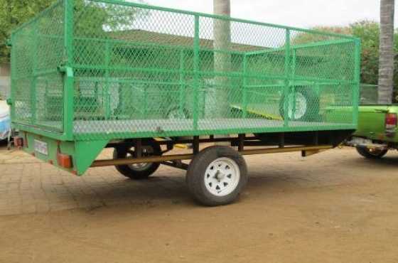 TRANSPORT GOODS ON A ALL PURPOSEFURNITURE TRAILER.