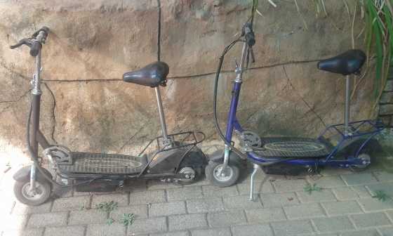 Two battery powered scooters