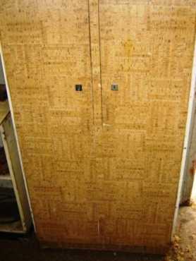 Two door steel cupboard, which was used to store workshop equipment.