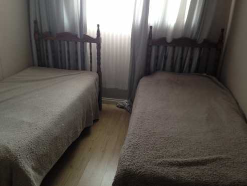 Two single beds (base  mattresses)