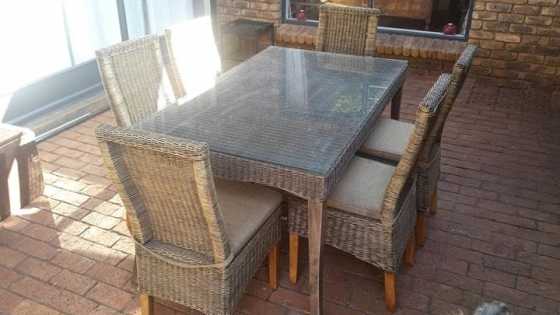 Weather wicker weave. Table has glass top. 6 chairs Offers will be considered