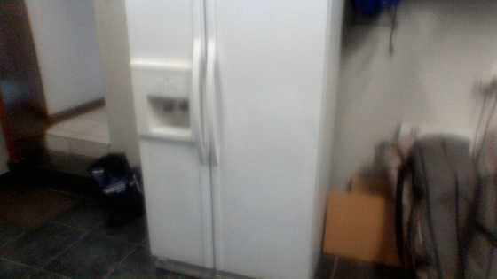 Whirlpool double door fridge freezer with ice and water dispenser