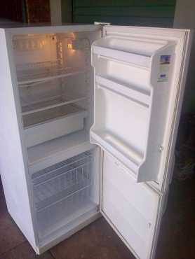 White KIC 320 liter double door fridge freezer with all its racks in good condition working perfect