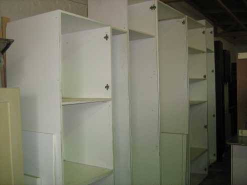 White melamine carcases without doors and draw units without draw fronts.