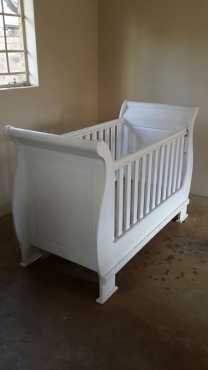 White sleigh cot for sale.