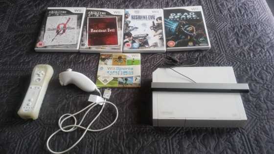 WII console and four games