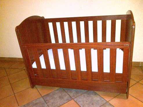 Wooden drop side cot