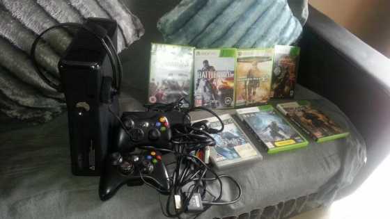 X box 360 black all cables 2 remotes, 7 games and headset