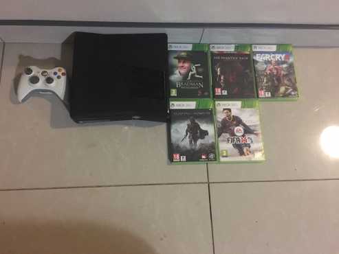 Xbox 360 for sale including one wireless controller and 5 games