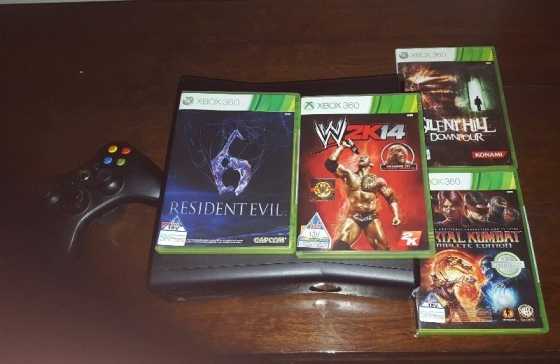 Xbox 360 for sale with 4 games and one remote.For R1800