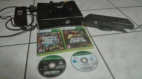 Xbox 360 slim with a KINECT, 5 games, 2 controllers