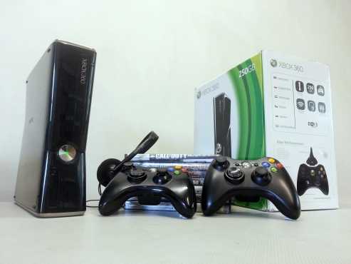 Xbox 360 with games and controllers