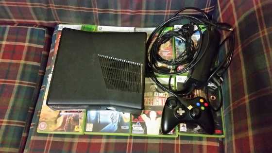 Xbox 360 with games for sale.