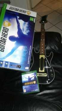 Xbox one with 12 games with exstra remote wit guitar hero