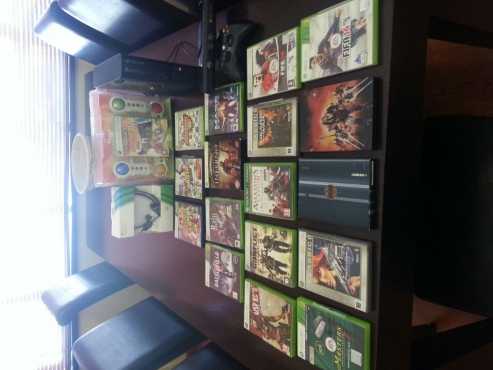 Xbox with kinetic, head gear and 18 games