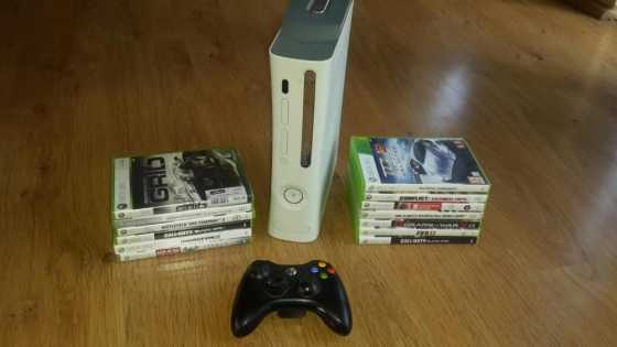 Xbox360 with a controller and 13 games for sale